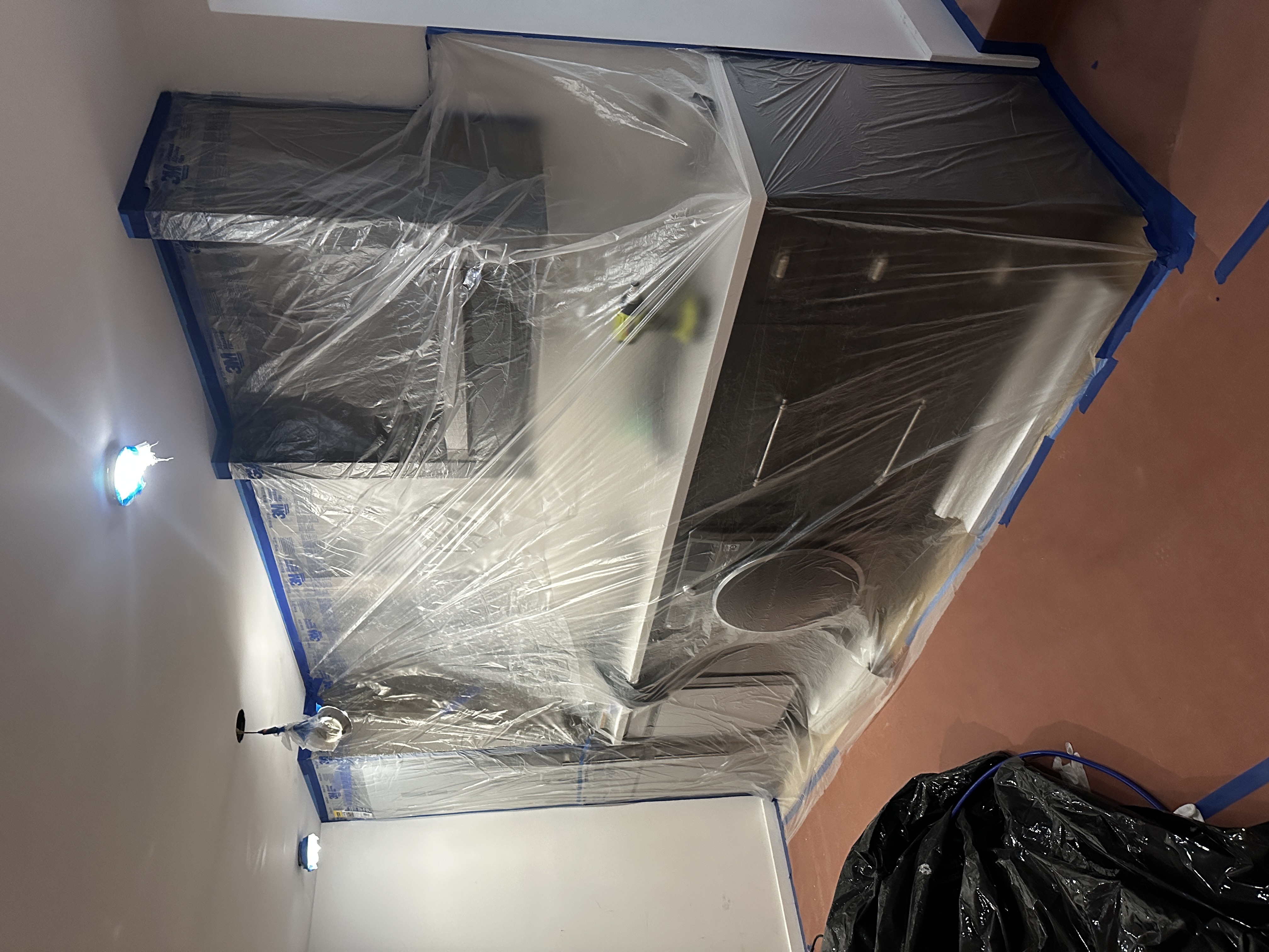 Kitchen cabinets protected for painting